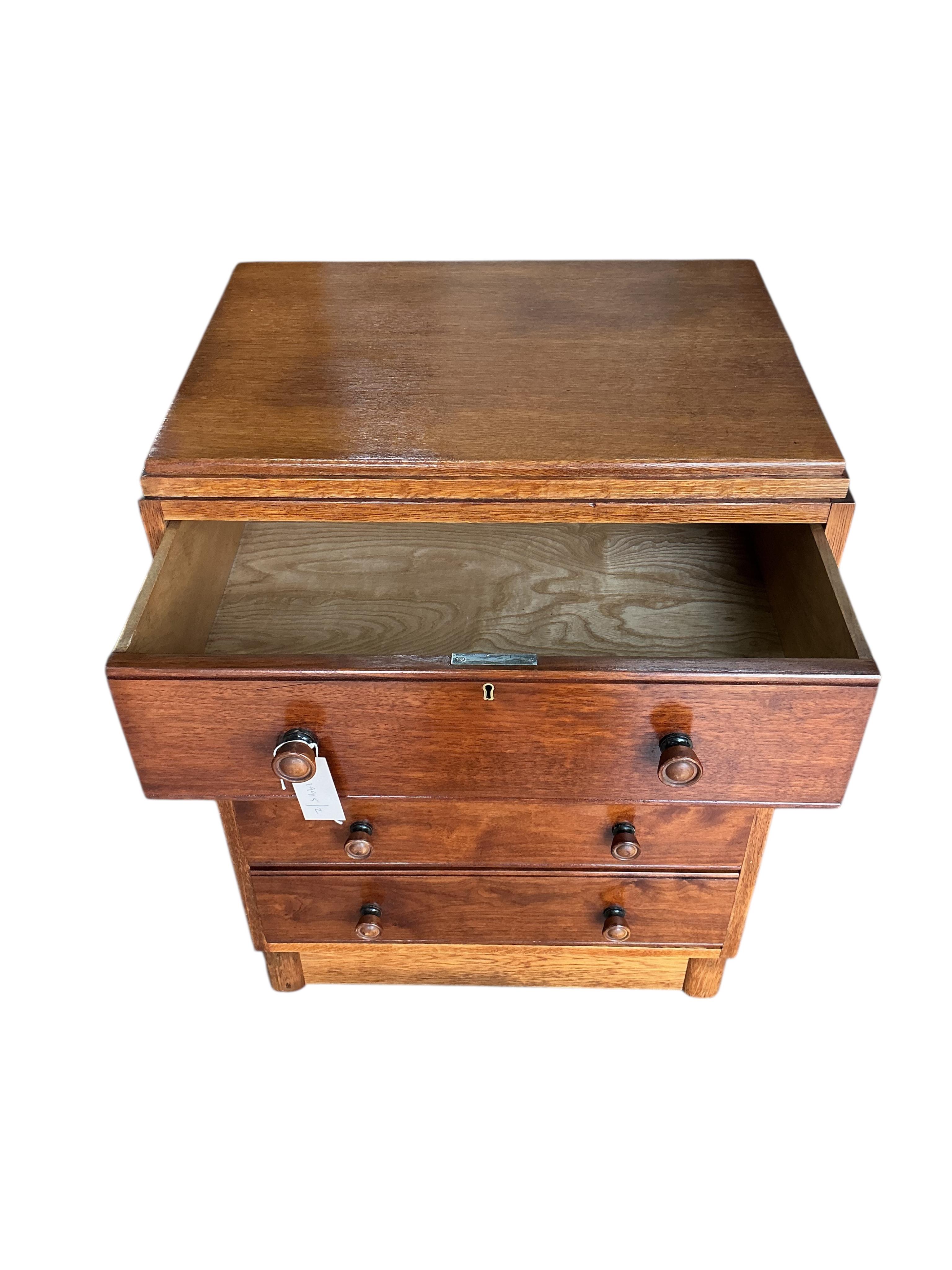A small early 20th century oak chest of four drawers, width 61cm, depth 44cm, height 83cm